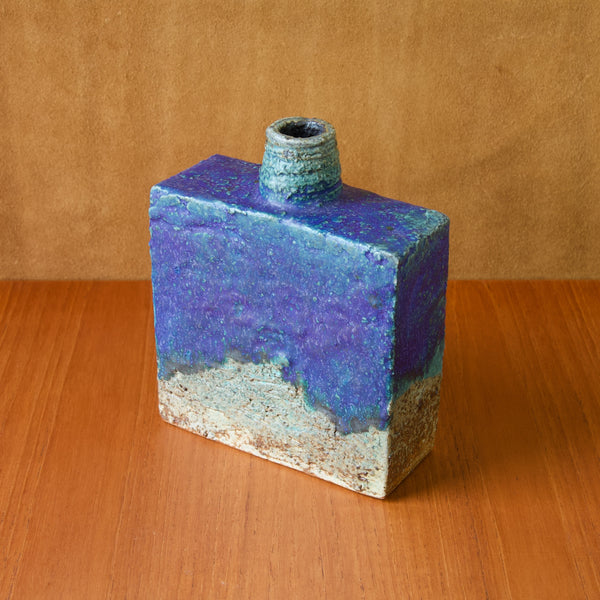 Top down view of a Annikki Hovisaari chamotte clay vase with a bold cobalt blue glaze. Annikki Hovisaari worked at Arabia in Helsinki for over a decade and won many international awards.