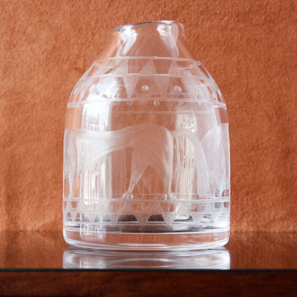 A beehive shaped clear glass vase designed by Erik Höglund, engraved pattern also by Erik Höglund. This is a rare early piece and arguably some of his best work!