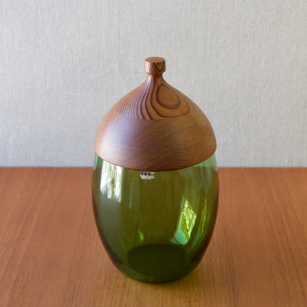 A large Erik Hoglund green glass and Swedish pine storage container in the shape of an acorn. 
