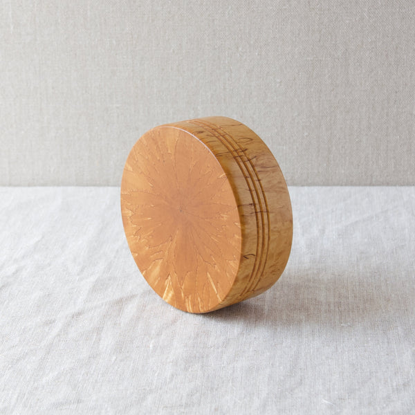 The back and side view of a Scandinavian lathe turned bowl made from Karelian curly warty birch. Buy Nordic design and antiques online at Art & Utility, London.