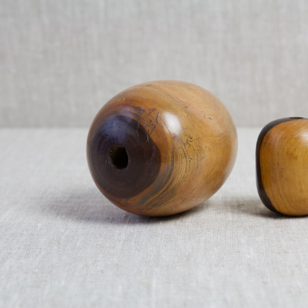 A large lignum vitae wood plumber's bobbin. Lignum vitae is the densest wood traded which makes it perfect for use as tools.