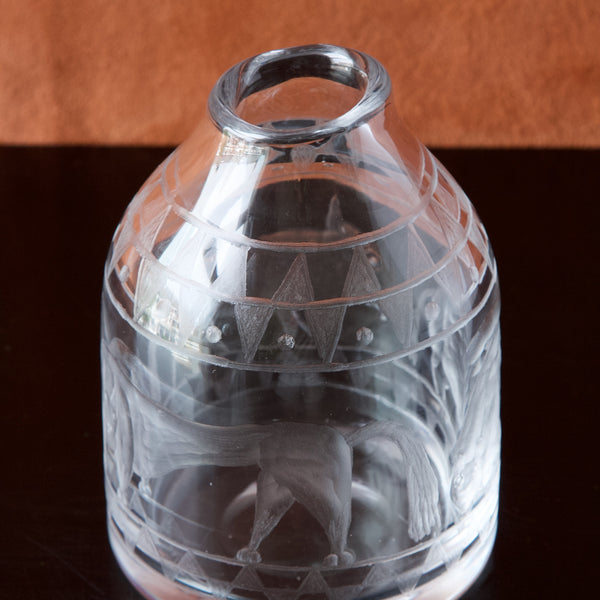 Top view showing the undulating rim of this thick walled clear glass vase designed by Erik Höglund. The shape is inspired by ancient Scandinavian vessels and tools. 